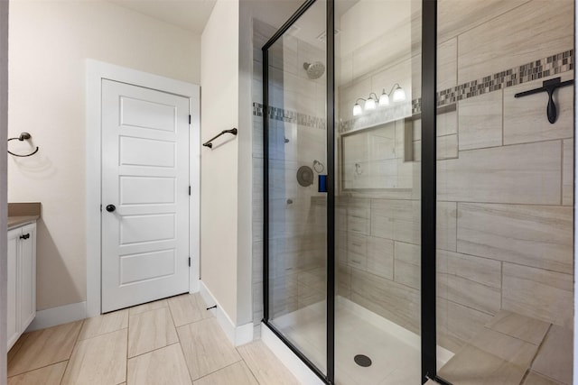 bathroom with tile patterned floors and walk in shower