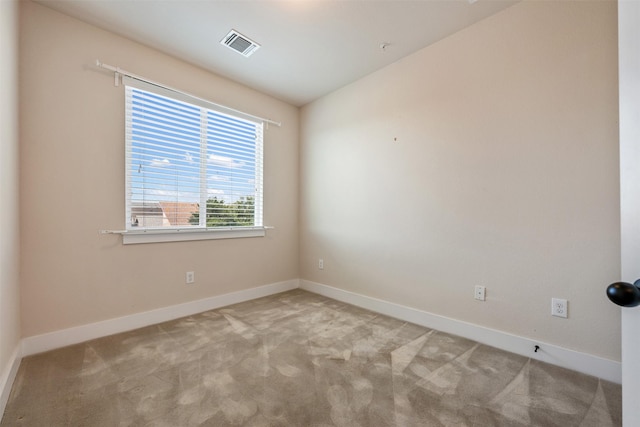 empty room featuring light colored carpet