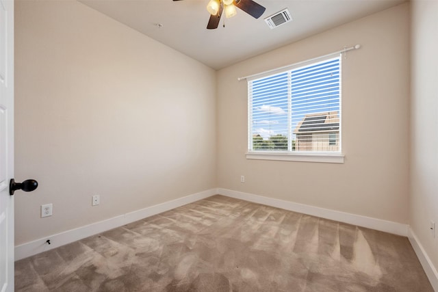 carpeted empty room with ceiling fan and vaulted ceiling