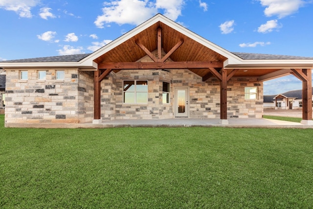 rear view of house with a yard