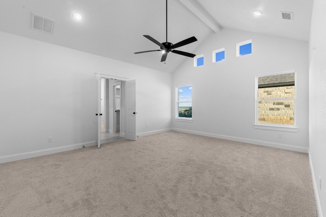 carpeted spare room featuring high vaulted ceiling, beamed ceiling, and ceiling fan