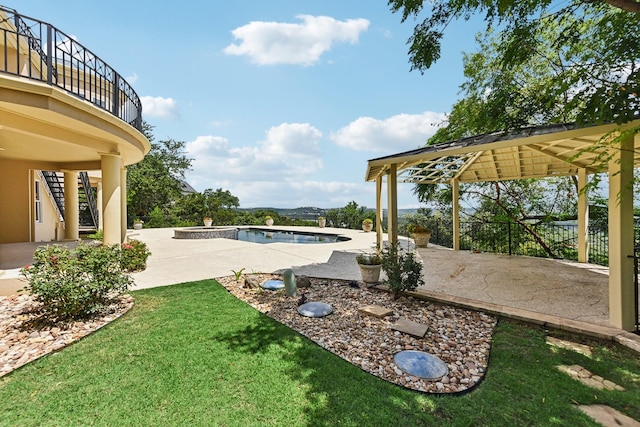 exterior space with a gazebo, a balcony, and a patio area