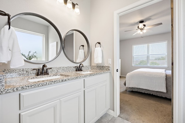 bathroom with ceiling fan and vanity