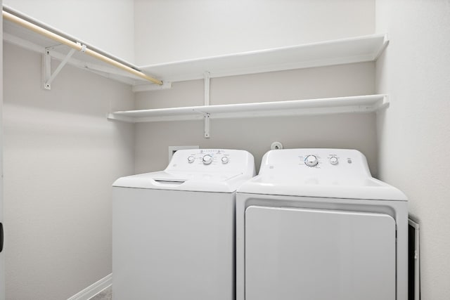 laundry room featuring separate washer and dryer