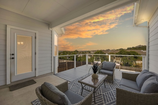 view of balcony at dusk