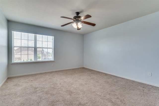 carpeted empty room with ceiling fan