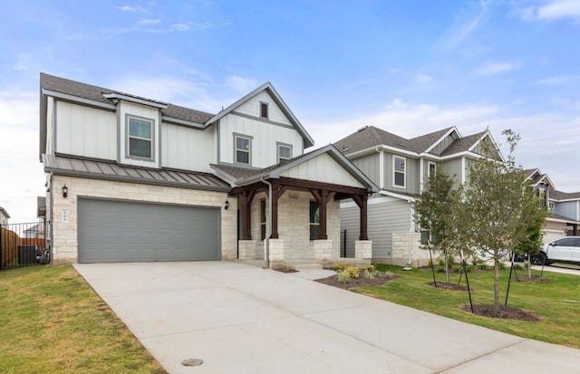 view of front of property featuring a front lawn and a garage