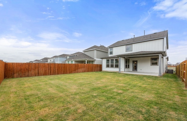 back of property featuring a patio area, a lawn, and central air condition unit