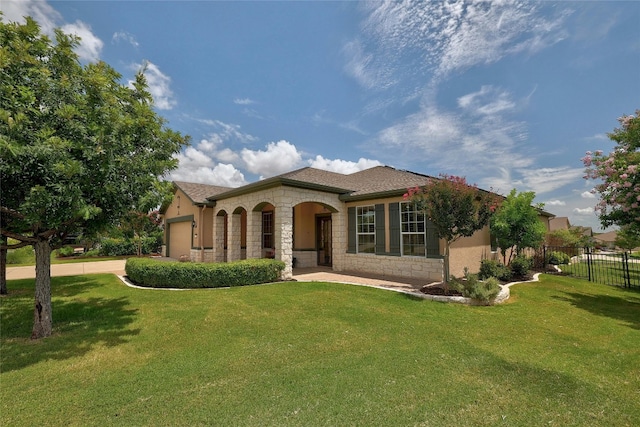 523 Mckittrick Ridge Rd, Georgetown, TX 78633 - mediterranean / spanish home with fence, a garage, a front lawn, and stone siding