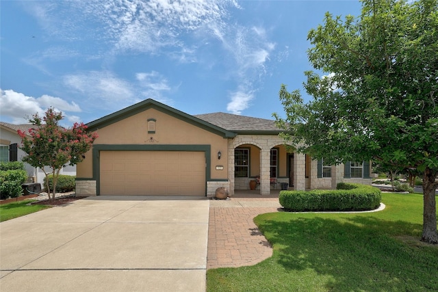 view of front of house with a garage and a front yard