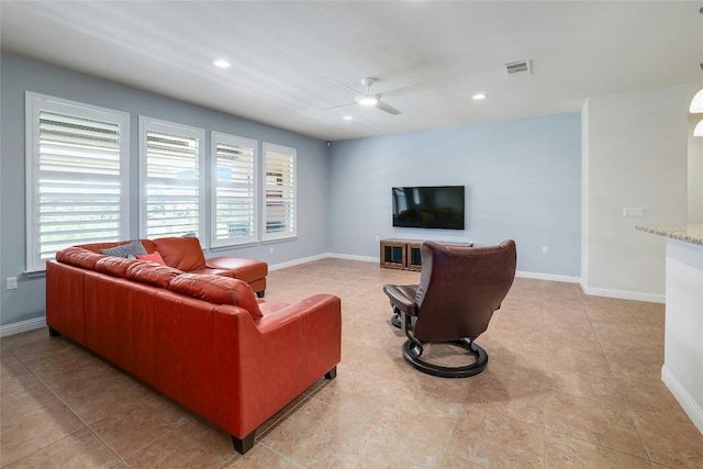 living room featuring light tile patterned floors and ceiling fan