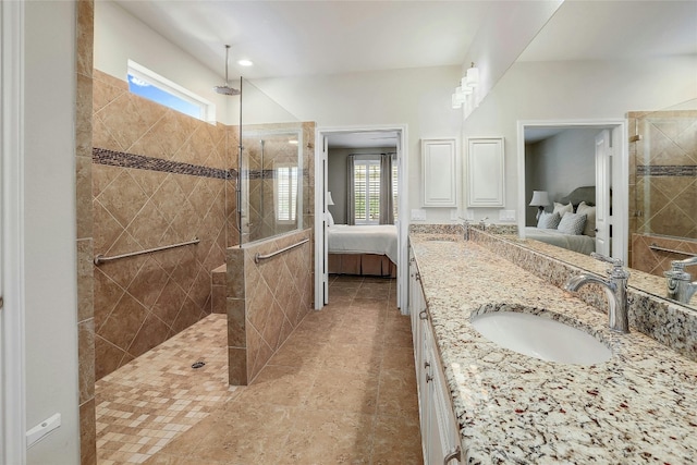 bathroom featuring vanity and a tile shower