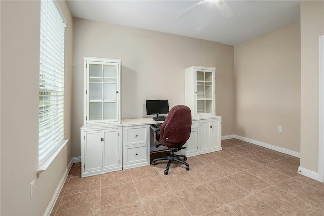 tiled office featuring ceiling fan