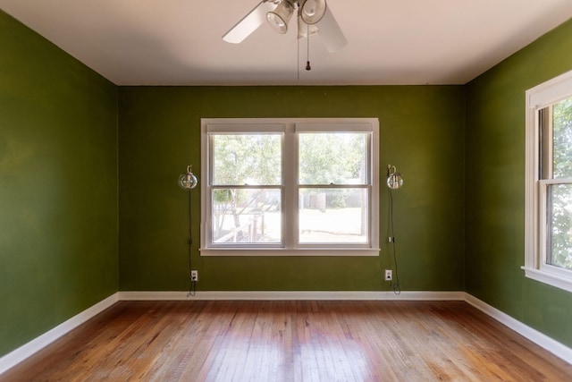 unfurnished room featuring light hardwood / wood-style flooring and ceiling fan