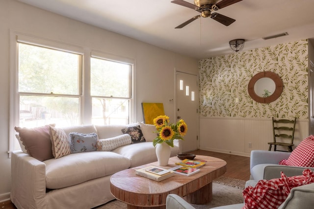 living room with hardwood / wood-style floors and ceiling fan