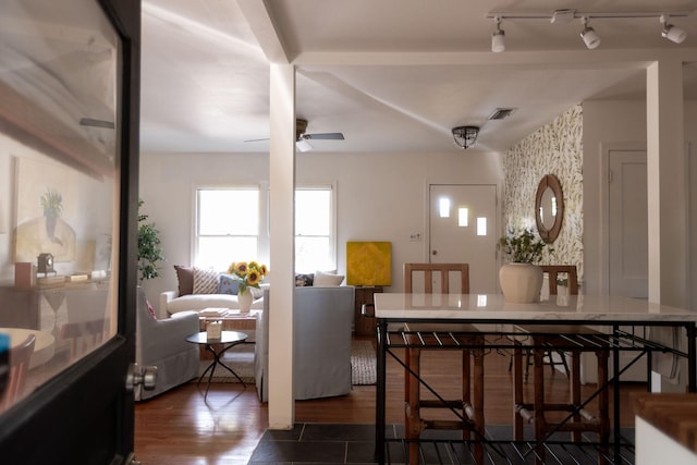 dining room with ceiling fan and dark hardwood / wood-style flooring