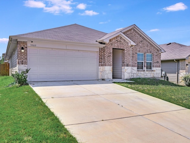 ranch-style house with a garage and a front lawn