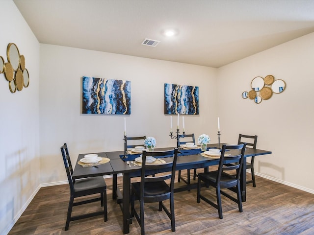 dining area with dark wood-type flooring