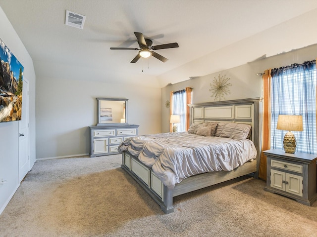 carpeted bedroom with lofted ceiling and ceiling fan