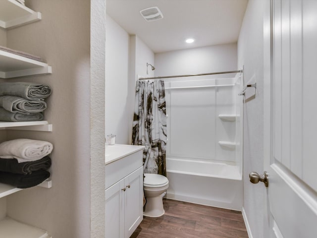 full bathroom featuring wood-type flooring, toilet, shower / tub combo with curtain, and vanity