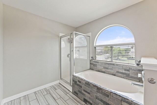 2700 Breezy Point Cv, Round Rock, TX 78665 - full bathroom featuring a garden tub and a stall shower