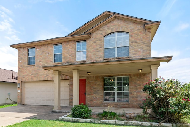 view of front facade with a garage and a porch