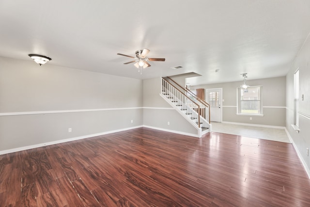 unfurnished room featuring ceiling fan and dark hardwood / wood-style floors