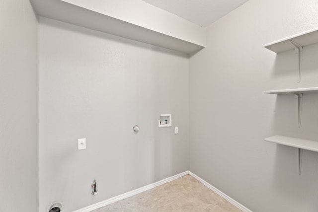 laundry area with hookup for a gas dryer and hookup for a washing machine