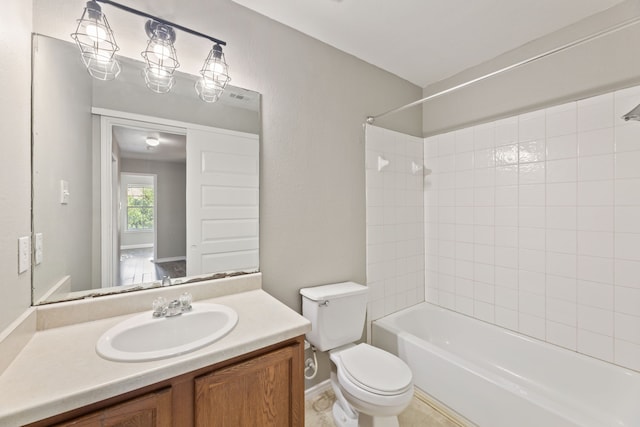 full bathroom with toilet, vanity, and tiled shower / bath combo