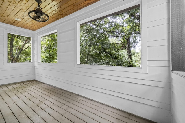 unfurnished sunroom featuring wood ceiling