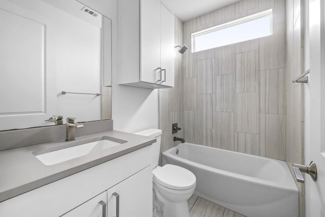 full bathroom featuring vanity, toilet, and shower / washtub combination