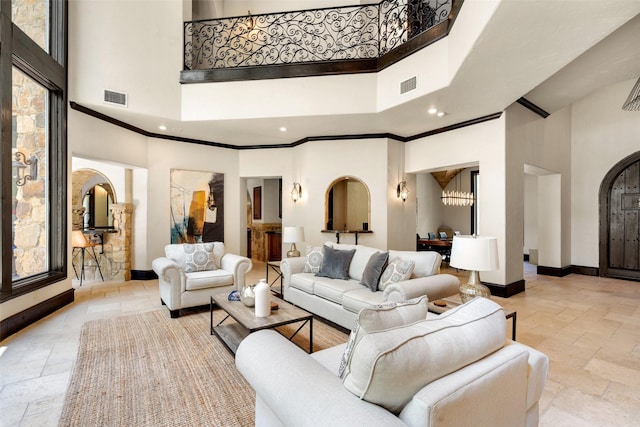 living room featuring a high ceiling