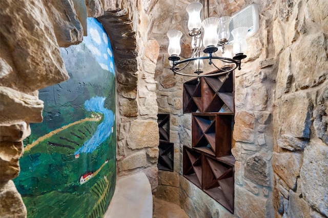 wine cellar featuring an inviting chandelier