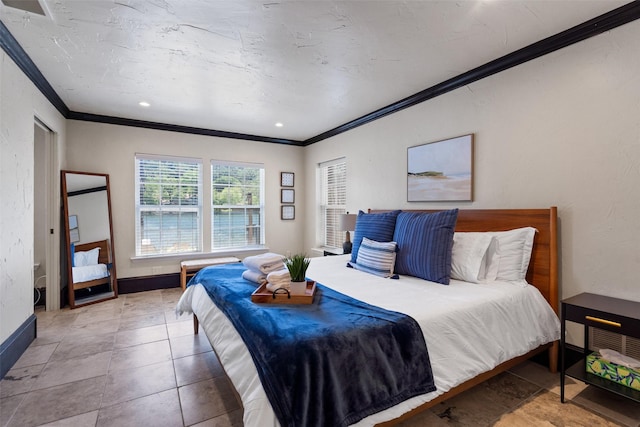 bedroom featuring ornamental molding and tile patterned floors