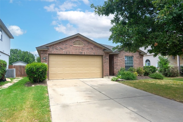 ranch-style home with a garage and a front lawn