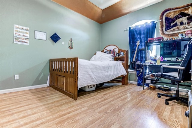 bedroom with wood-type flooring