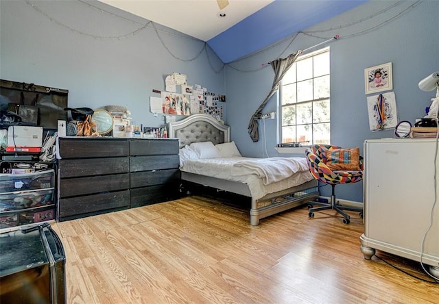 bedroom featuring light hardwood / wood-style flooring and ceiling fan