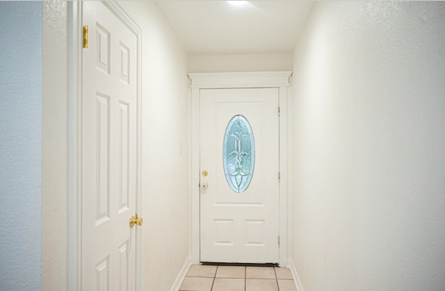 entryway featuring light tile patterned flooring