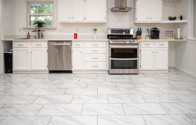 kitchen featuring extractor fan, stainless steel appliances, sink, and white cabinets