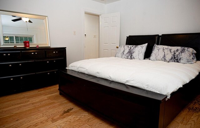 bedroom with ceiling fan and light hardwood / wood-style floors