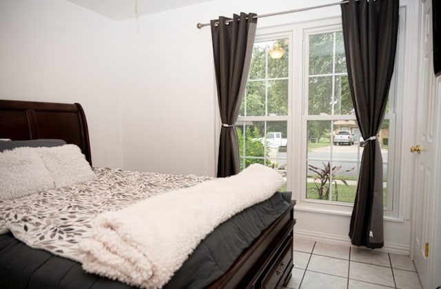 bedroom featuring light tile patterned floors