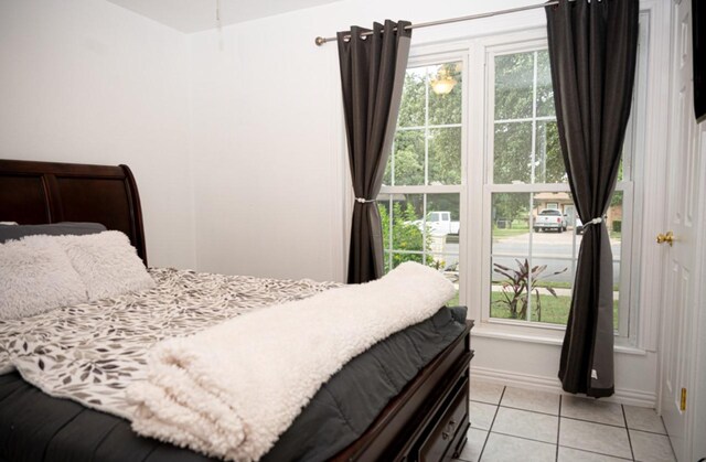 bedroom featuring light tile patterned floors