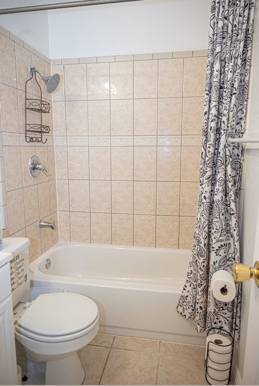 full bathroom with shower / tub combo with curtain, vanity, tile patterned floors, and toilet