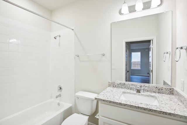 full bathroom featuring vanity, toilet, and shower / tub combination