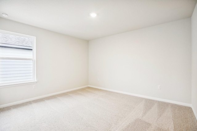 unfurnished room featuring carpet flooring