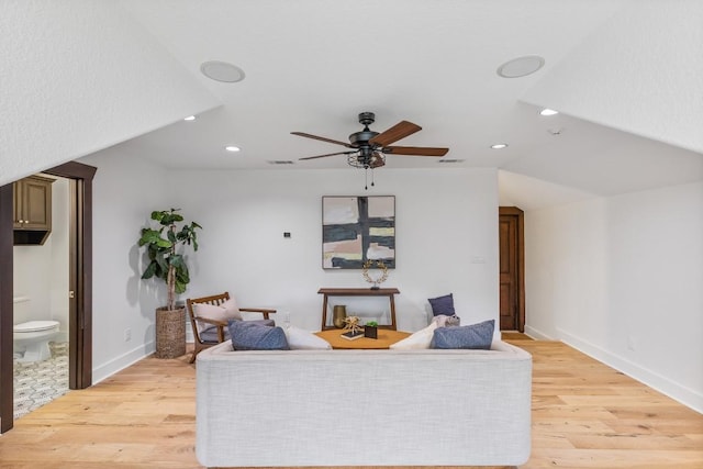 living area featuring recessed lighting, baseboards, light wood-style floors, and a ceiling fan