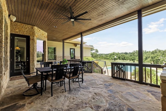 view of patio featuring outdoor dining space, an outdoor pool, and ceiling fan