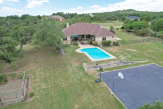 view of swimming pool featuring a fenced in pool, a patio, a yard, and fence private yard