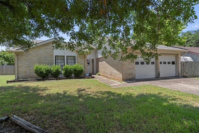 ranch-style house with a garage and a front lawn