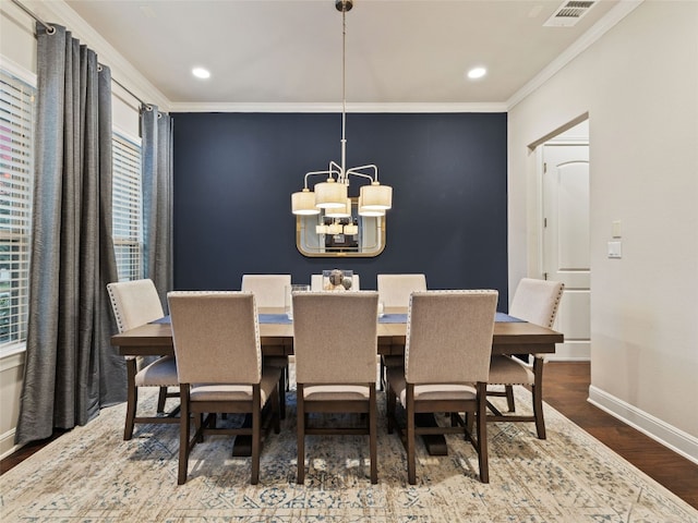 3417 Flat Iron Ct, Leander, TX 78641 - dining space featuring a chandelier, wood finished floors, ornamental molding, and recessed lighting